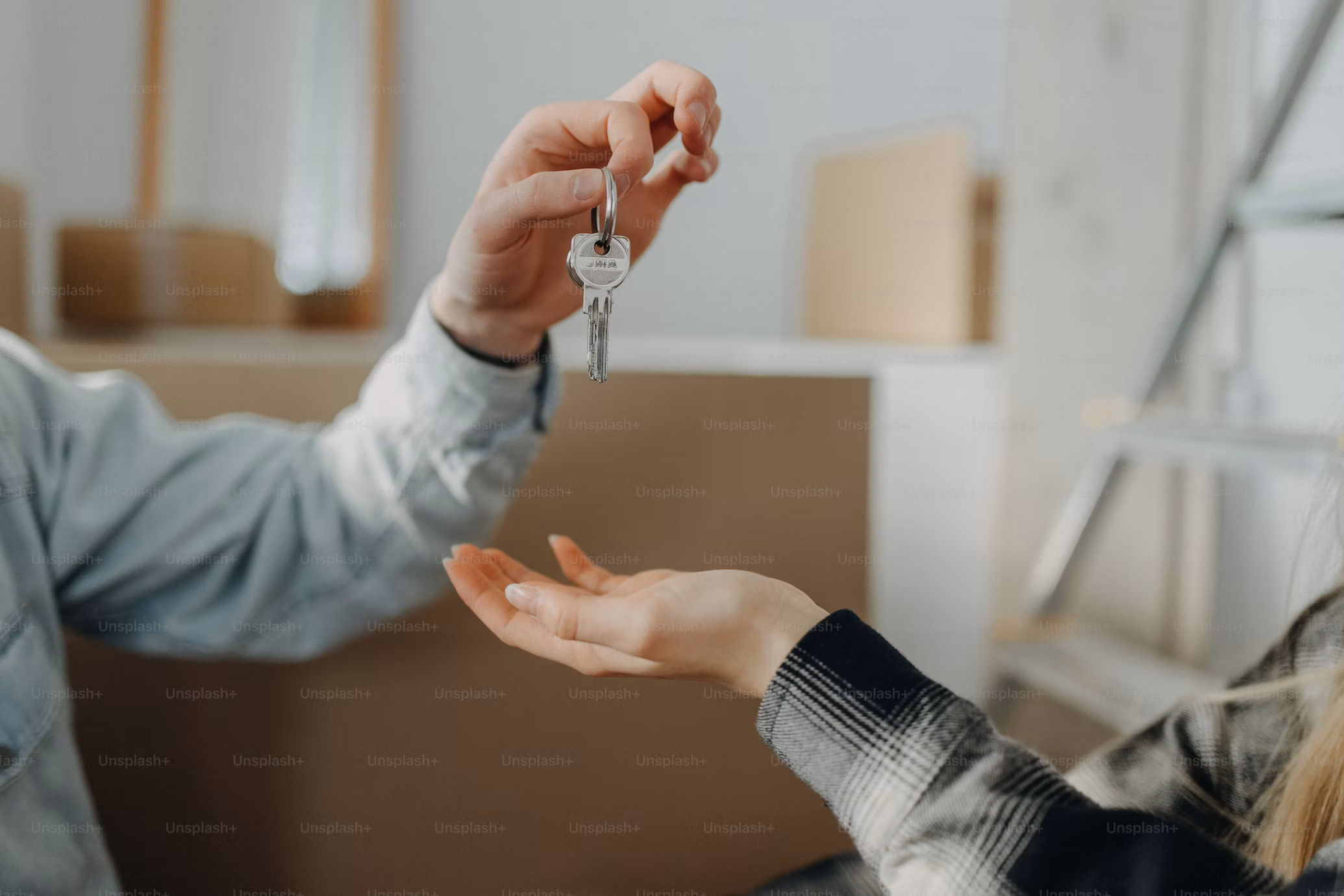 Landlord handing over keys to a new tenant